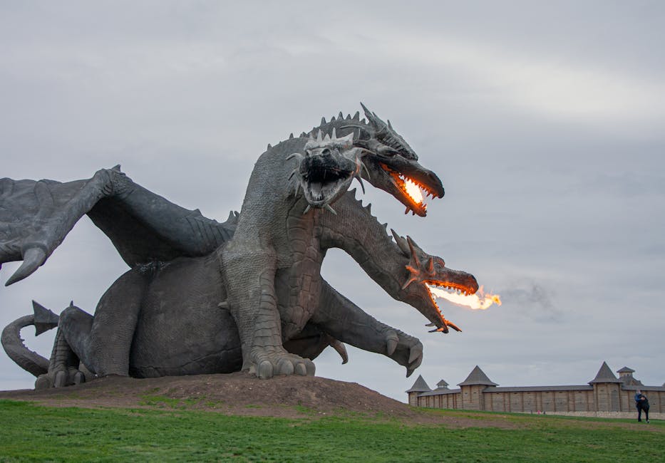 Majestic dragon sculpture breathing fire, set in an open park area, perfect attraction for fantasy lovers.