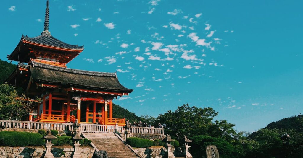 Beautiful view of Kiyomizu Dera Temple in Kyoto, showcasing traditional Japanese architecture under a vibrant sky.