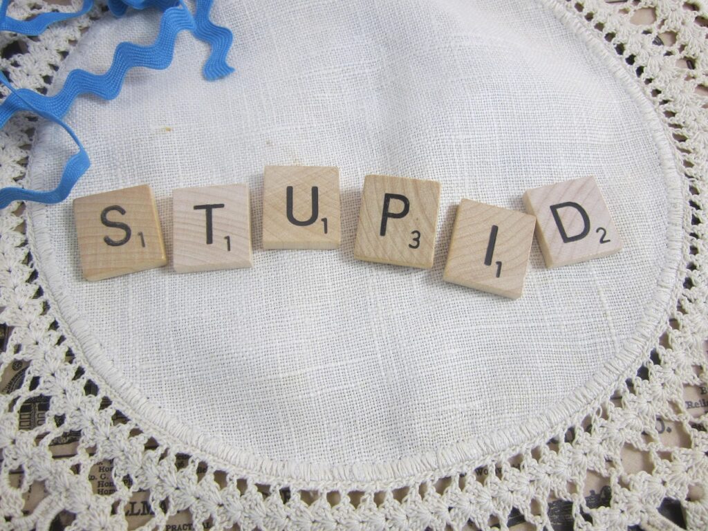 the word stupid, scrabble tiles, spelling stupid, word